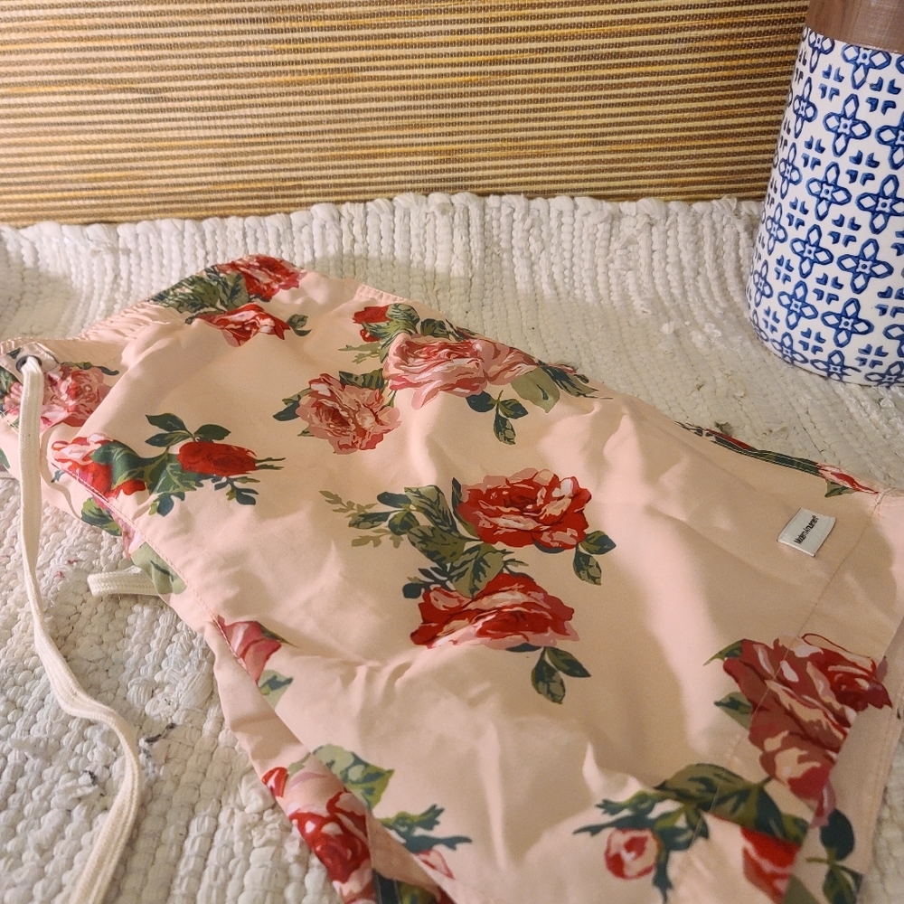 Men's peach floral swim trunks